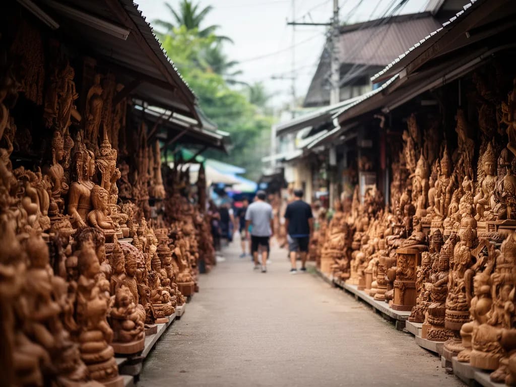 Row of antique opium beds and Chinese altars in a Ban Tawai showroom