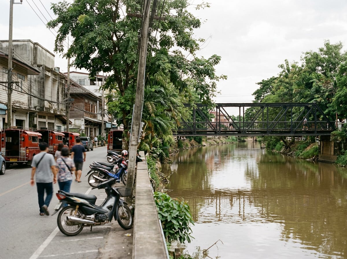 Riverside view of Praisani Road with the Iron Bridge in the background