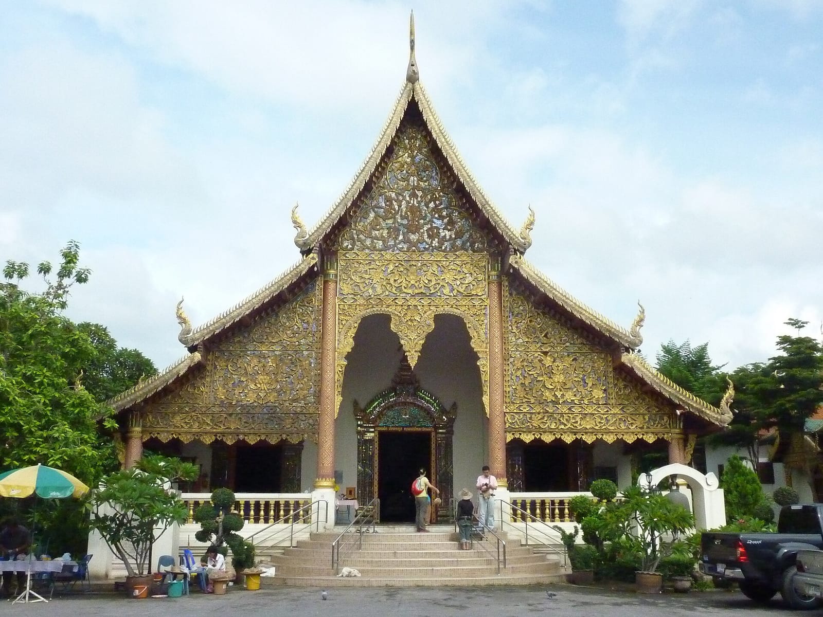 Main viharn of Wat Chiang Man with three-tiered Lanna roof and gilded gable carving