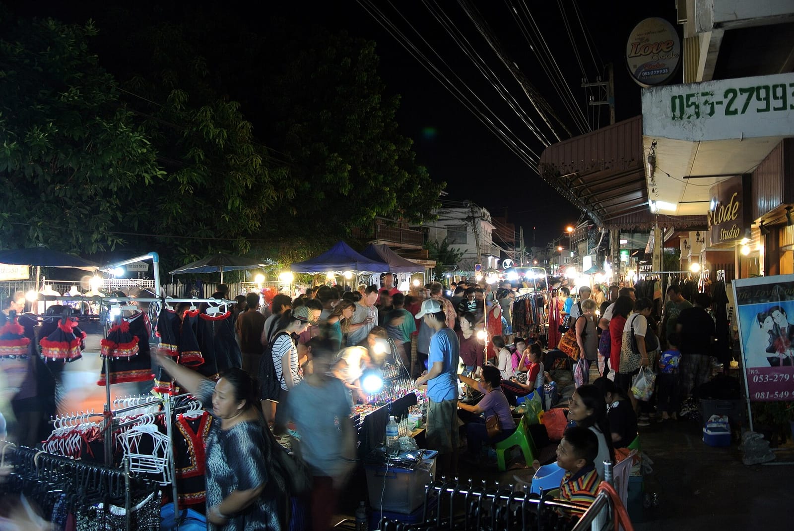 Saturday Walking Street market on Wua Lai Road after dark, with stalls and crowds filling the road